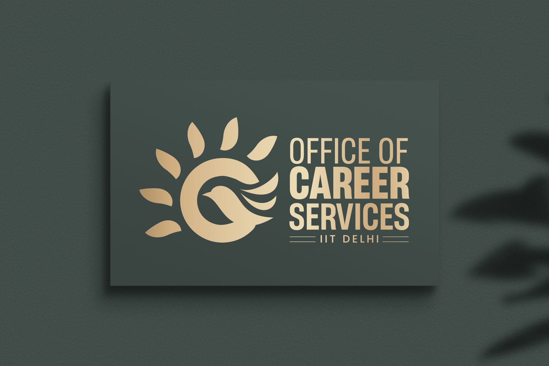 The OCS logo in warm gold on a deep green business card.